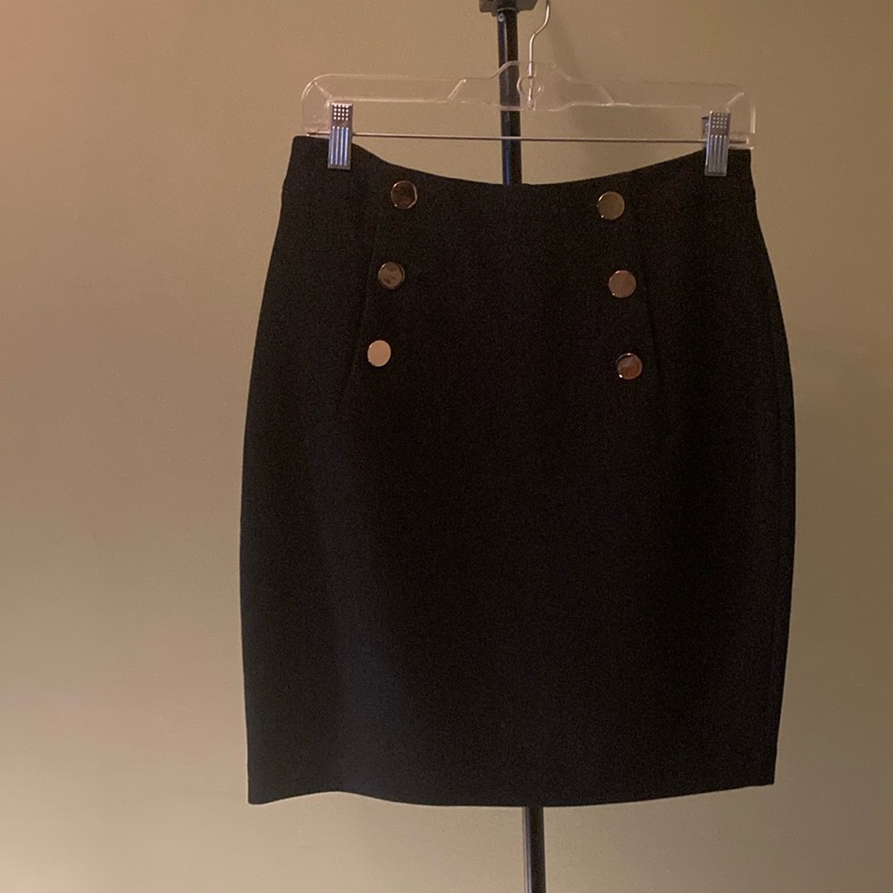Black skirt with brass buttons